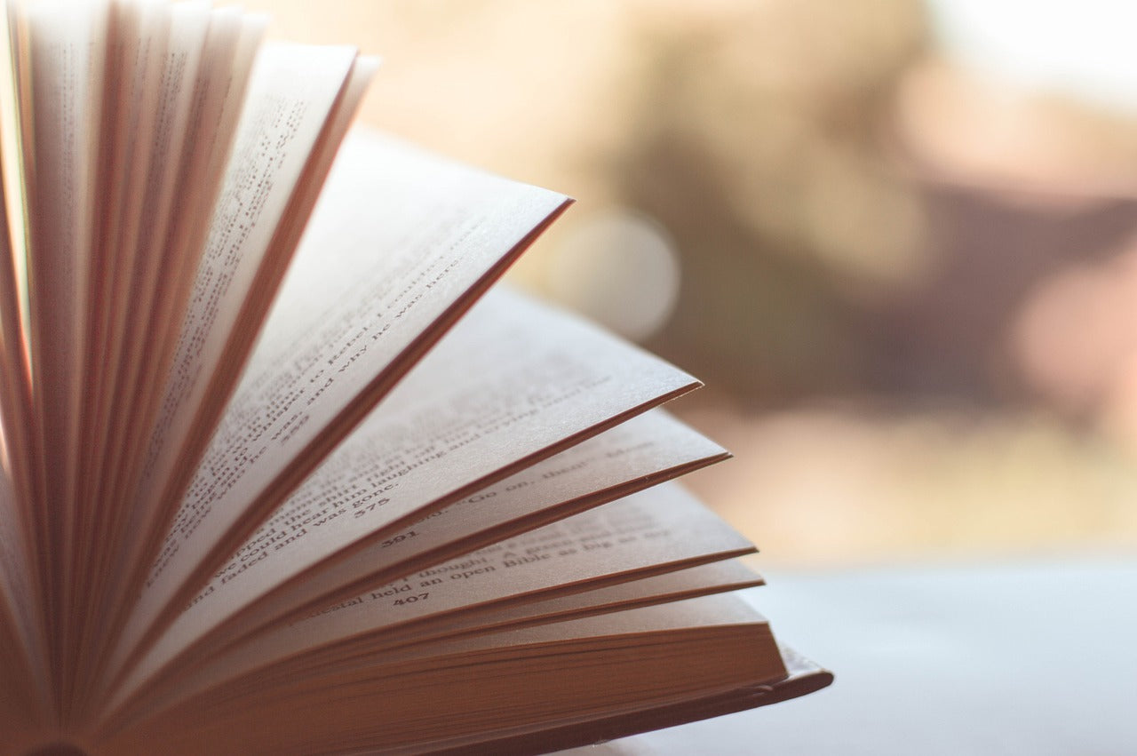 A book with open pages on a table.